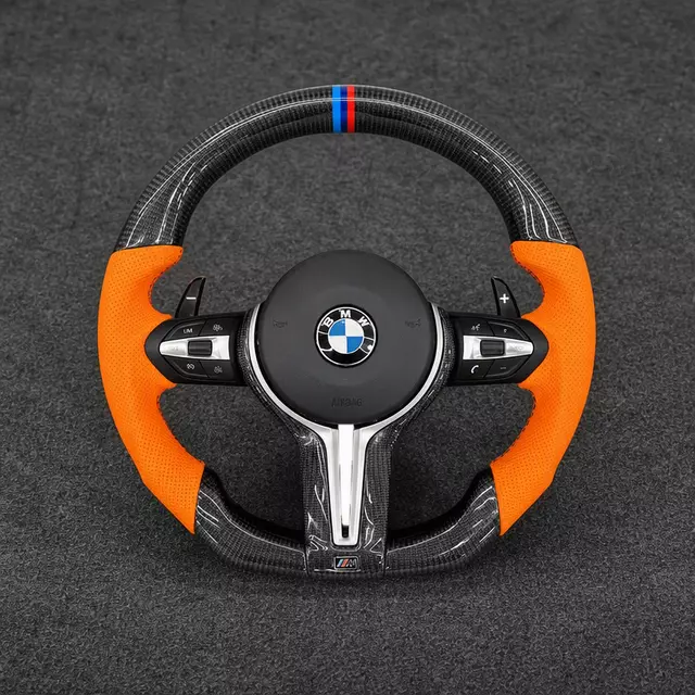Custom carbon fiber steering wheel for BMW, orange alcantara grips, M tri‑color stripe, paddle shifters, M sport