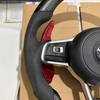 Close-up of stitching on modified Volkswagen steering wheel, ergonomic car tuning component