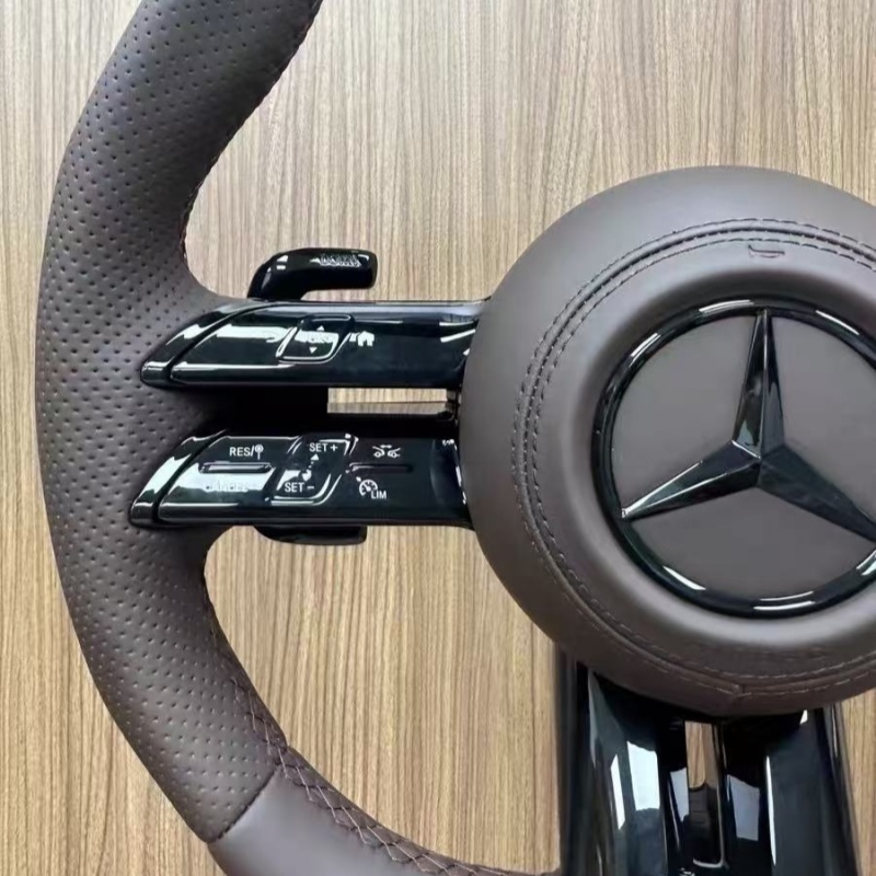 High quality Mercedes-Benz steering wheel detail shot, fine stitching leather material