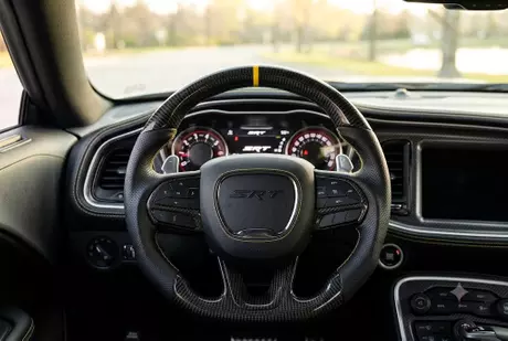black-carbon-fiber-yellow-stripe-srt-steering-wheel-cockpit.webp