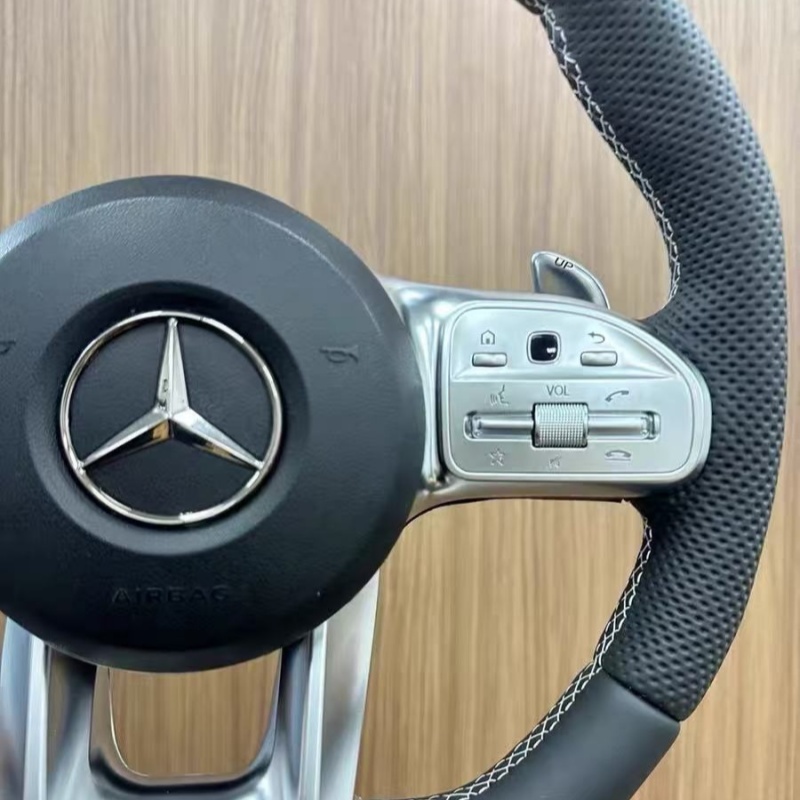 High quality Mercedes-Benz steering wheel detail shot, fine stitching leather material