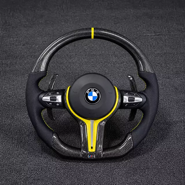Custom carbon fiber steering wheel for BMW, yellow center marker, perforated leather, paddle shifters, M sport upgrade