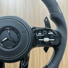 Close-up view of Mercedes sport steering wheel, ergonomic design for vehicle upgrade