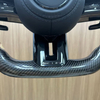 Close-up view of Mercedes sport steering wheel, ergonomic design for vehicle upgrade