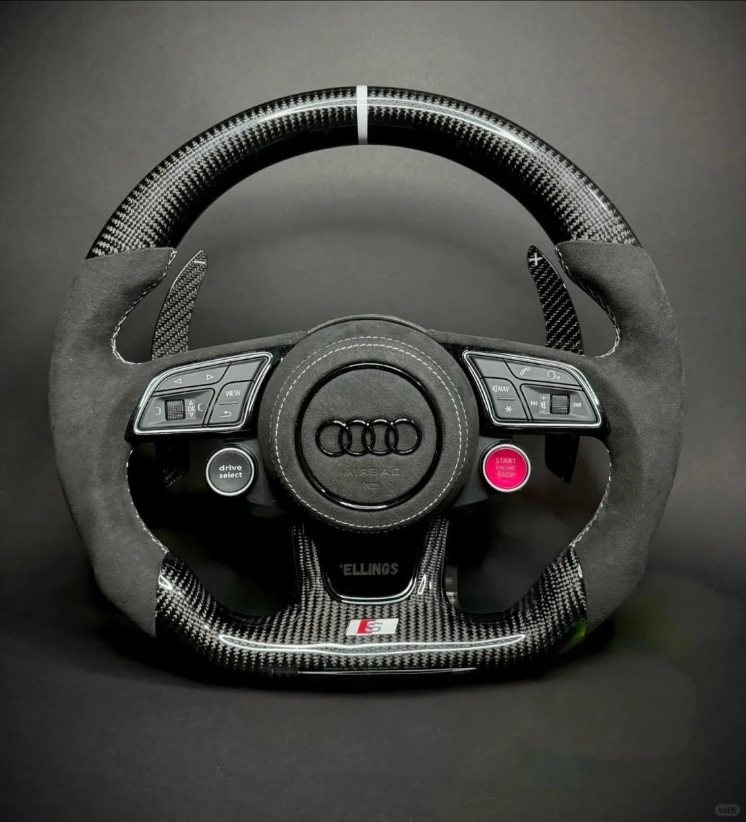 Custom forged carbon fiber Audi steering wheel with Alcantara grips, white 12 o'clock marker, and integrated red engine start/stop button