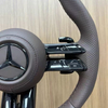 Close-up view of Mercedes sport steering wheel, ergonomic design for vehicle upgrade