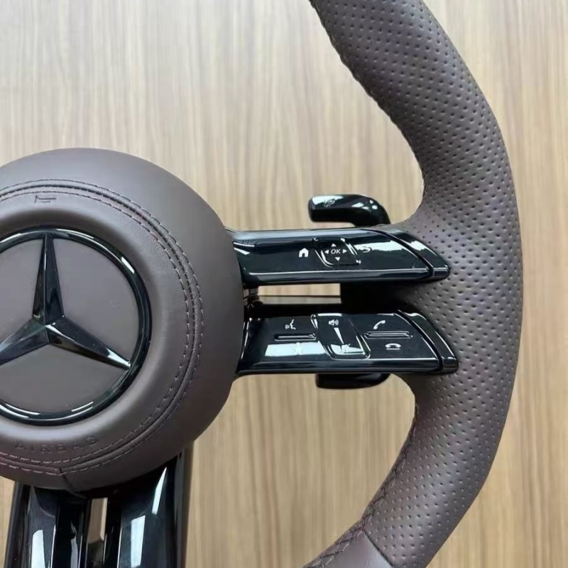 Close-up view of Mercedes sport steering wheel, ergonomic design for vehicle upgrade
