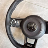 Close-up of stitching on modified Volkswagen steering wheel, ergonomic car tuning component