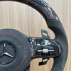 High quality Mercedes-Benz steering wheel detail shot, fine stitching leather material