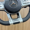Close-up view of Mercedes sport steering wheel, ergonomic design for vehicle upgrade